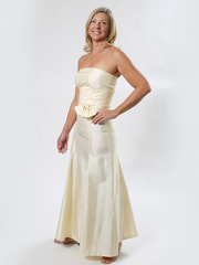 vanilla long gala dress in natural silk, wavy ruffles at the waist and a loose bow, flared skirt