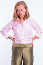 bronze trousers in natural silk, straight legs, wide belt, shiny finish, pink shirt in natural sleeves