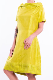 yellow, green short sleeves dress in natural silk, raised boat neckline, tulip-shaped